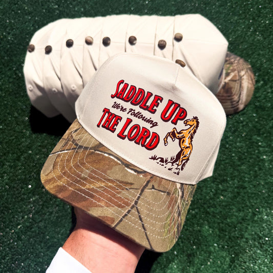 Wholesale: Saddle Up We're Following The Lord Hat | Discounted Hat Bundles | Trending and In Demand Hats for Businesses & Boutiques